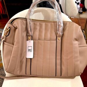 NWT TAN FULLY LINED BAG.  Plenty of pockets and compartments!